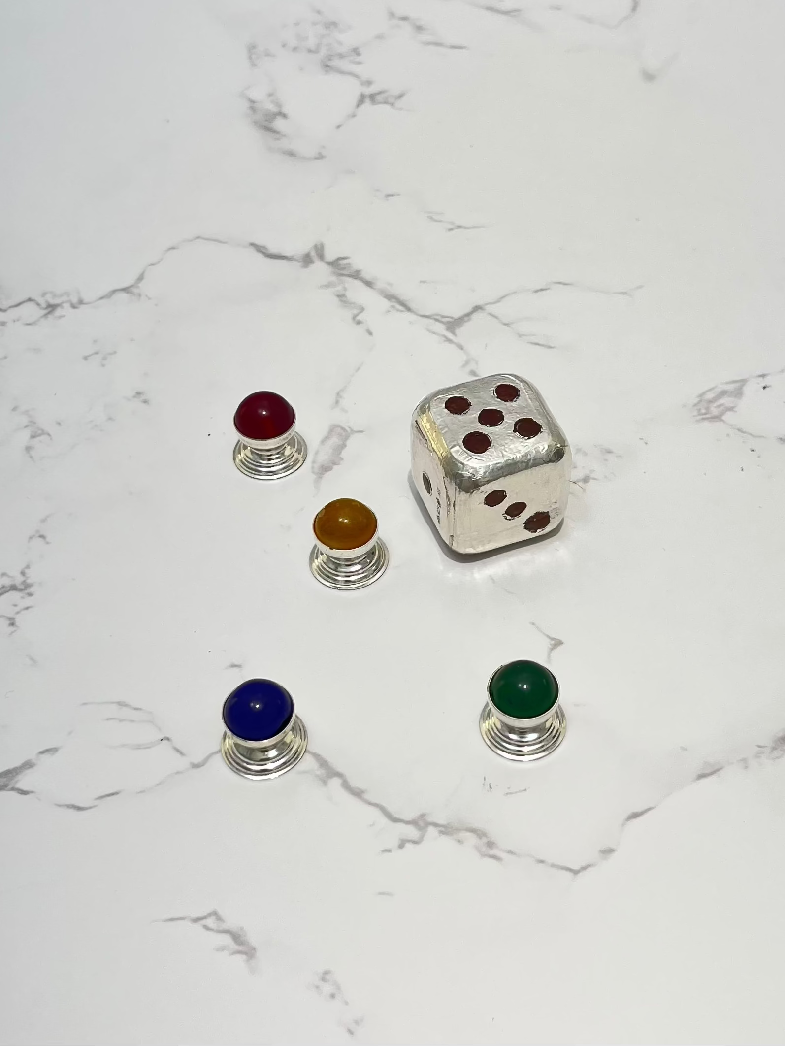 Set of colorful dice on a marble surface