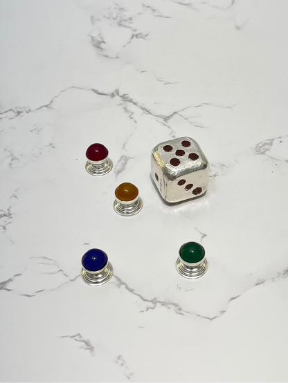 Set of colorful dice on a marble surface